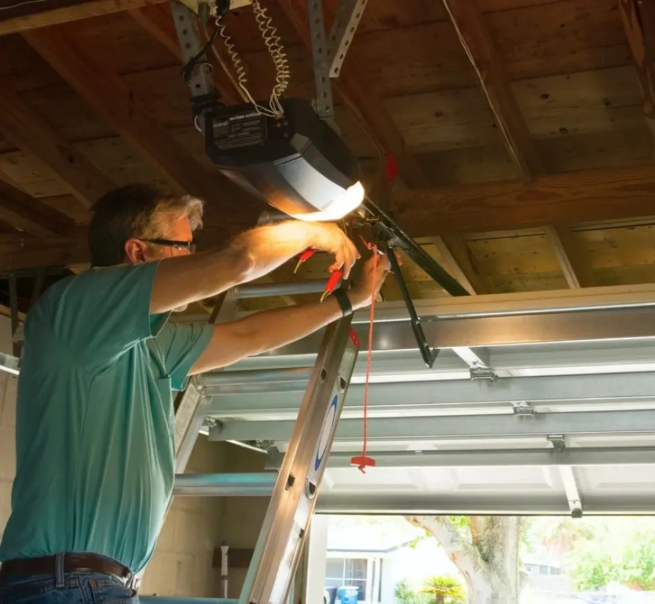 Technician installing a garage door opener